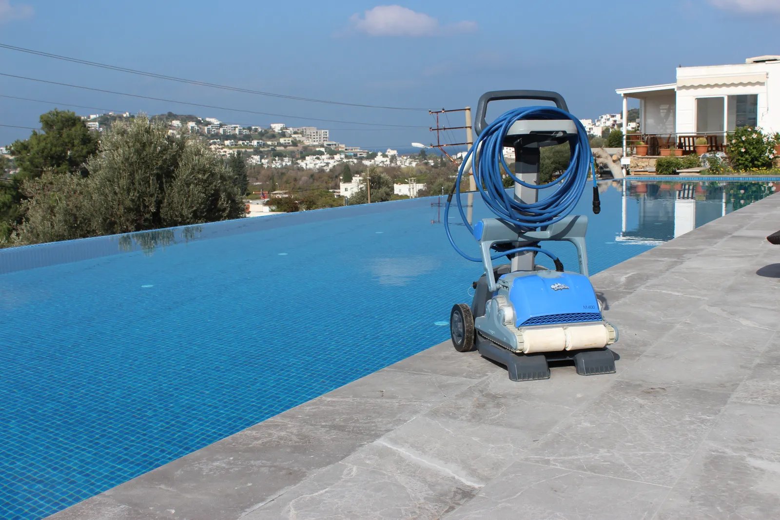 Pool cleaning equipment beside a pool